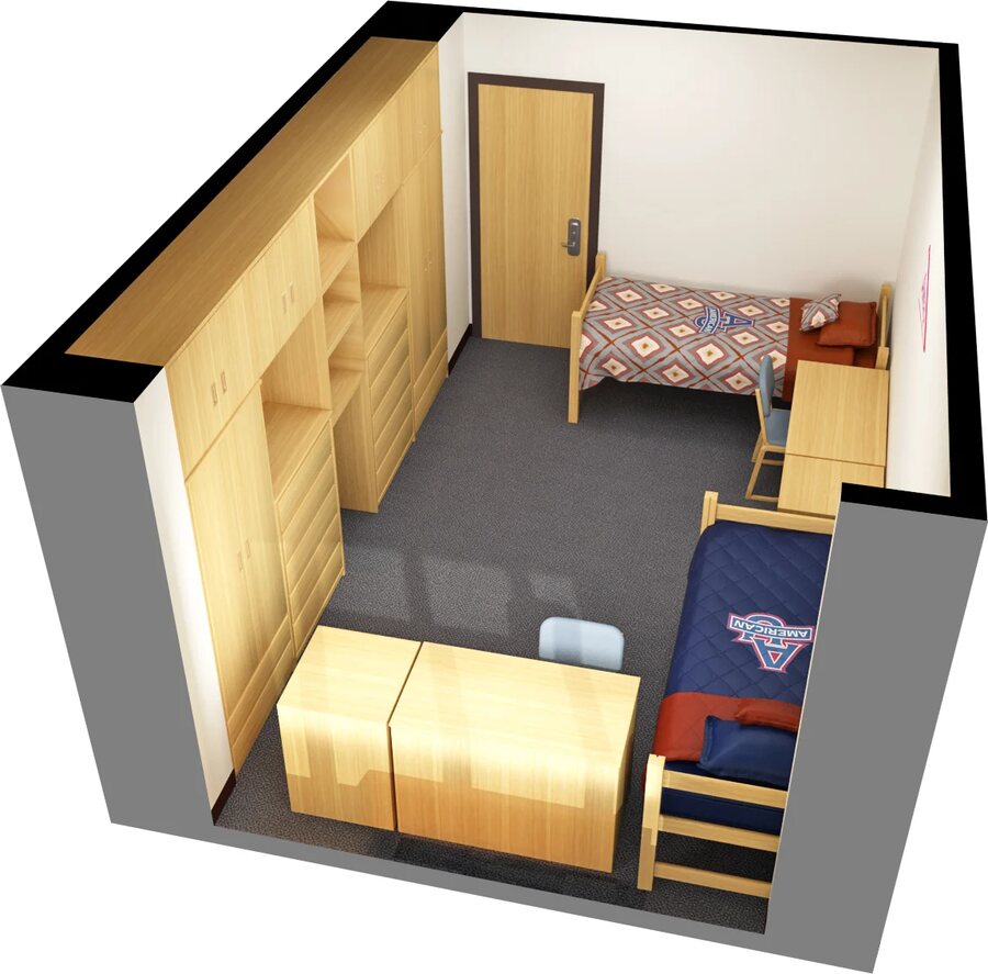 A cutaway model of an American University residence hall room, with two single beds, built-in wardrobes and shelving, a desk and chair, and two chests of drawers.